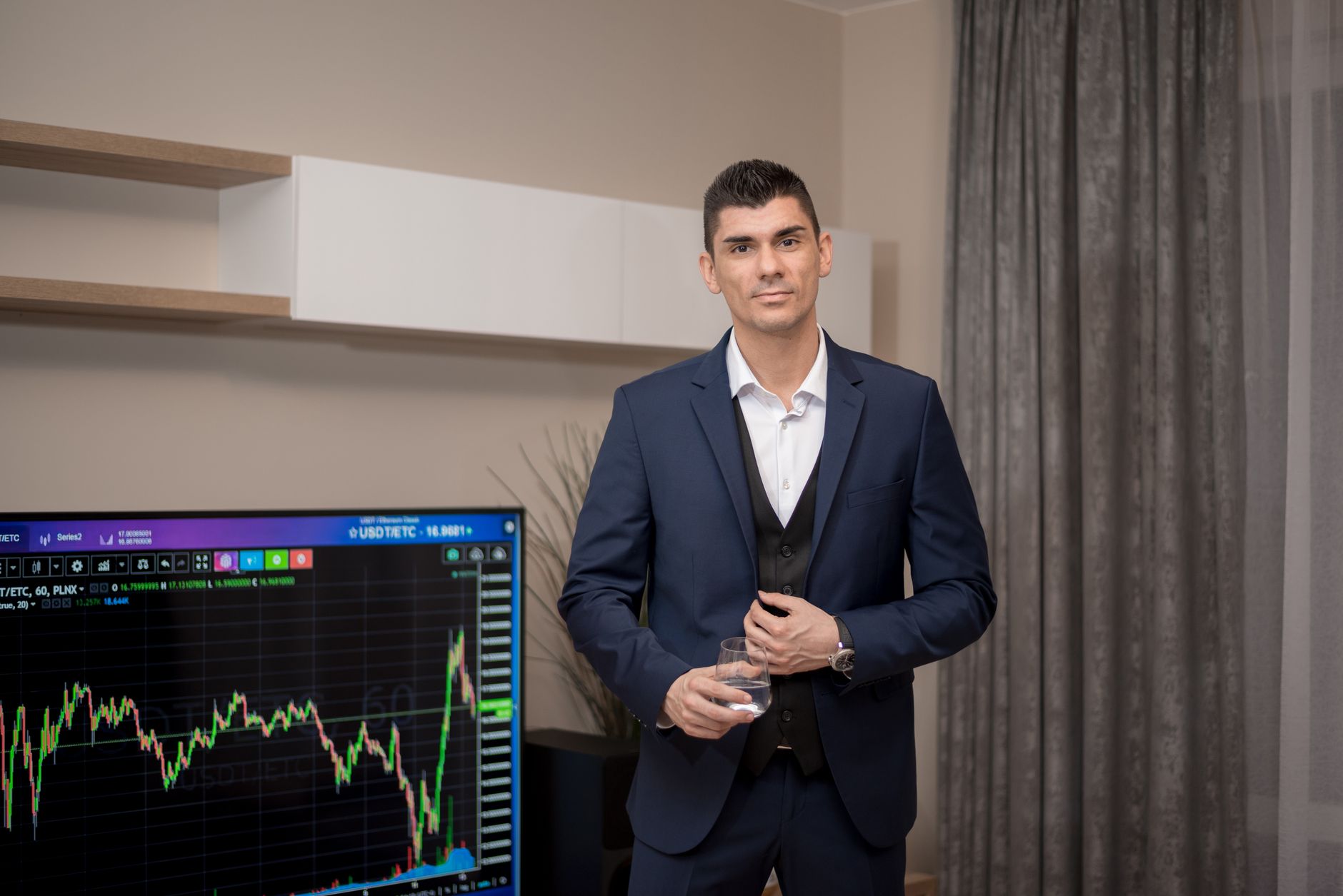 Person standing beside financial charts